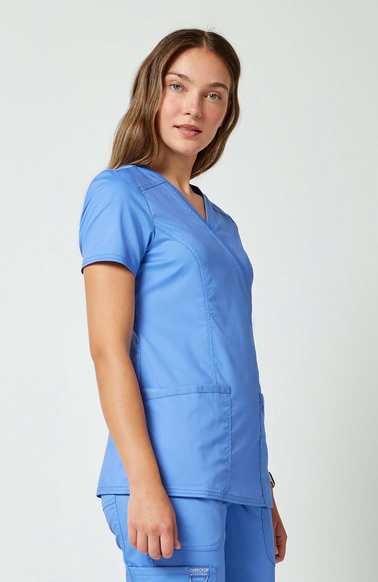Cherokee WW Revolution Women's Shaped 3-Pocket Mock Wrap Scrub Top