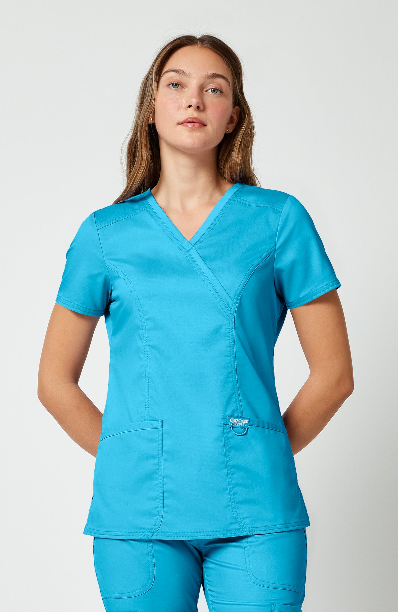 Cherokee WW Revolution Women's Shaped 3-Pocket Mock Wrap Scrub Top